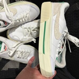 Nike White Sneakers with Cream Sole and Green Stripe